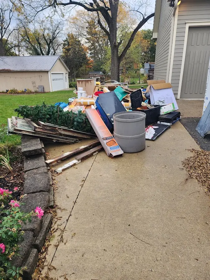 Dumpster being loaded with debris for 30 Yard Dumpster Rental in Round Lake Park